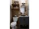 Unique rustic-style bathroom boasts wood accents, stone vanity, a modern vessel sink, and shelving at 8626 Junco Trl, Evergreen, CO 80439