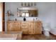 Bathroom with double vanity, large mirror, bathtub, and tile flooring at 8626 Junco Trl, Evergreen, CO 80439