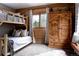 Charming wood-paneled bedroom features bunk beds, ample closet space, and bright window views at 8626 Junco Trl, Evergreen, CO 80439
