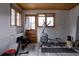 Home gym with exercise equipment, wood accents, and natural light at 8626 Junco Trl, Evergreen, CO 80439