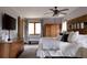 Spacious main bedroom featuring a dresser, wardrobe, modern ceiling fan, and a comfortable bed at 8626 Junco Trl, Evergreen, CO 80439