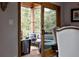 Inviting outdoor patio with comfortable seating and views of lush green trees and natural landscape at 8626 Junco Trl, Evergreen, CO 80439
