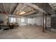 Unfinished basement with concrete floor, exposed ceiling and support beams, ready to be customized at 8548 S Quatar St, Aurora, CO 80016