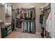 Spacious walk-in closet with custom shelving and ample storage for organizing your wardrobe and accessories at 8548 S Quatar St, Aurora, CO 80016