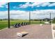 Open community space with outdoor seating, lighting, and recreational games for residents at 8548 S Quatar St, Aurora, CO 80016