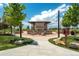 Outdoor community fireplace area surrounded by lush landscaping and comfortable seating at 8548 S Quatar St, Aurora, CO 80016