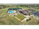 A luxurious community center featuring a sparkling pool, manicured lawn, and tennis courts for active residents at 8548 S Quatar St, Aurora, CO 80016