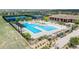 Overhead shot of a community pool with lounge chairs and pergola near tennis courts at 8548 S Quatar St, Aurora, CO 80016