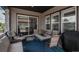 Inviting covered patio area featuring a dining set, comfortable seating, and outdoor living space at 8548 S Quatar St, Aurora, CO 80016