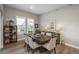 Inviting dining room featuring wood floors, natural light, and tasteful decor at 8548 S Quatar St, Aurora, CO 80016