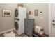 This laundry room features a front loading washer and dryer and a tile floor at 8548 S Quatar St, Aurora, CO 80016