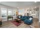 Open-concept design shows a living room with kitchen and dining area at 8548 S Quatar St, Aurora, CO 80016