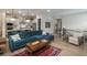 Open concept featuring the living room, kitchen, and stairway to the second floor at 8548 S Quatar St, Aurora, CO 80016