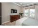 Stylish bedroom featuring a large window, modern decor, and ample space for relaxation and comfort at 8548 S Quatar St, Aurora, CO 80016