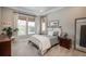 Serene bedroom with plush carpet, natural light, and elegant decor creates a comfortable retreat at 8548 S Quatar St, Aurora, CO 80016