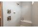 Modern walk-in shower features beautiful tiling, built-in bench, and contemporary fixtures for a spa-like experience at 8548 S Quatar St, Aurora, CO 80016