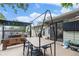 Outdoor patio with a dining area, complete with a hanging swing and a relaxed ambiance at 309 S 30Th Ave, Brighton, CO 80601