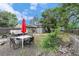Backyard with an outdoor dining area, plus a recreational vehicle on the gravel surface at 309 S 30Th Ave, Brighton, CO 80601