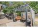 Backyard featuring an outdoor dining area, firepit and decorative privacy screen with cafe lights at 309 S 30Th Ave, Brighton, CO 80601