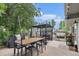 Backyard featuring an outdoor dining and entertaining area, plus a decorated privacy screen at 309 S 30Th Ave, Brighton, CO 80601