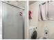 Bathroom featuring a shower and a stacked washer and dryer at 309 S 30Th Ave, Brighton, CO 80601
