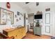 Cozy room featuring a mix of vintage and playful decor, plus an open doorway to the upper level at 309 S 30Th Ave, Brighton, CO 80601