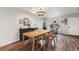 Bright dining area features natural light, stylish furnishings, and hardwood floors at 309 S 30Th Ave, Brighton, CO 80601