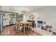 Well-lit kitchen/dining area featuring an eat-in dining table, hardwood floors, and access to the backyard at 309 S 30Th Ave, Brighton, CO 80601