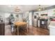 Bright eat-in kitchen and dining area featuring modern appliances and stylish wood flooring at 309 S 30Th Ave, Brighton, CO 80601