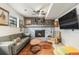 Cozy basement living room with a fireplace, rustic decor, and comfortable seating area at 309 S 30Th Ave, Brighton, CO 80601