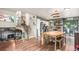 Open-concept eat-in kitchen and living room with modern decor, stainless appliances, and hardwood floors at 309 S 30Th Ave, Brighton, CO 80601