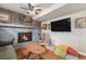 Comfortable living room with brick fireplace, wood paneling, and TV at 309 S 30Th Ave, Brighton, CO 80601