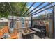 Backyard retreat featuring bench seating, a fire pit, and a decorative metal privacy screen at 309 S 30Th Ave, Brighton, CO 80601