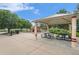 Community playground featuring covered picnic tables, lush landscaping and a nearby drinking fountain at 309 S 30Th Ave, Brighton, CO 80601