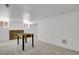 Finished basement with foosball table and carpet throughout the open space at 1455 Hudson St, Denver, CO 80220