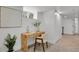 A finished basement with light wood floors, a modern desk, and a contemporary chair at 1455 Hudson St, Denver, CO 80220