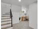 Finished basement with stairs leading to a desk area with a chair, plant and lots of light at 1455 Hudson St, Denver, CO 80220