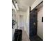 Stylish bathroom featuring a black marble shower, herringbone floors, and a modern vessel sink at 1455 Hudson St, Denver, CO 80220