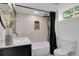 Modern bathroom featuring a shower with a black rainfall shower head and a built in storage space at 1455 Hudson St, Denver, CO 80220