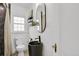 Modern bathroom features a sleek vessel sink, matte black faucet, and unique vanity at 1455 Hudson St, Denver, CO 80220