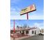 Nuggs Ice Cream: Bright and fun commercial building with outdoor seating, and inviting signage at 1455 Hudson St, Denver, CO 80220