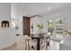 Bright dining room with modern furniture and French doors to the patio at 1455 Hudson St, Denver, CO 80220