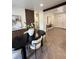 Stylish dining room featuring modern decor, hardwood floors, and lots of natural light at 1455 Hudson St, Denver, CO 80220