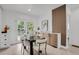 Elegant dining room with modern furniture, stylish accent wall, and plenty of natural light at 1455 Hudson St, Denver, CO 80220