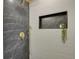 Modern shower featuring designer tile, a rainfall shower head and convenient shelf at 1455 Hudson St, Denver, CO 80220