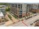 Elevated view of modern building with outdoor dining and vibrant pedestrian area at 20 Wilcox St # 318, Castle Rock, CO 80104