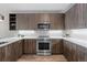 Modern kitchen featuring stainless steel appliances, stylish cabinetry, white countertops, and contemporary design elements at 20 Wilcox St # 318, Castle Rock, CO 80104