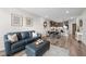 Comfortable living room featuring a plush sofa, modern decor, and an open-concept layout connected to the kitchen at 20 Wilcox St # 318, Castle Rock, CO 80104