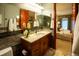 Bathroom featuring a glass shower, stylish vanity with modern fixtures, and an adjacent bedroom view at 2800 S University Blvd # 184, Denver, CO 80210