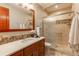 Bathroom featuring a glass shower, stylish vanity with modern fixtures, and tiled shower at 2800 S University Blvd # 184, Denver, CO 80210